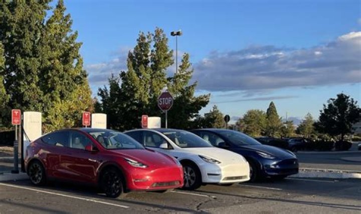 How do I check my Tesla free Supercharging miles?