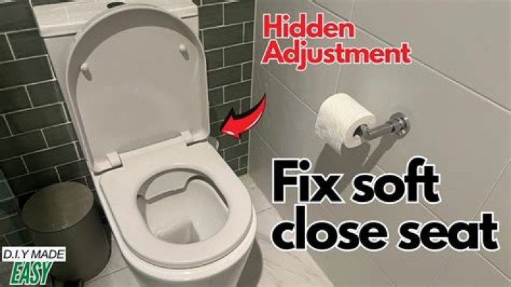 How do you reset a soft close toilet seat?
