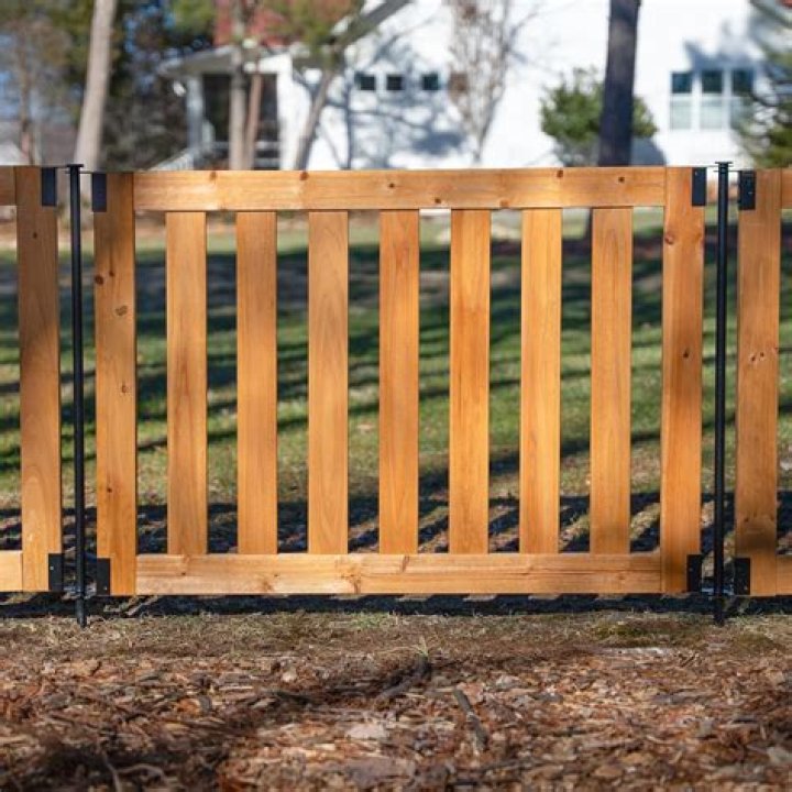 What's cheaper wood fence or metal fence?
